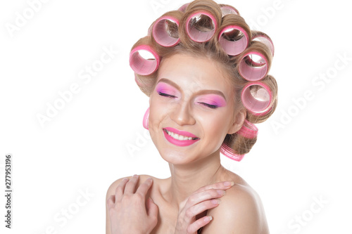 portrait of beautiful woman with hair curlers