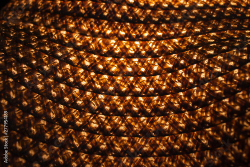 pattern of old straw hat with illuminating from beneath into her