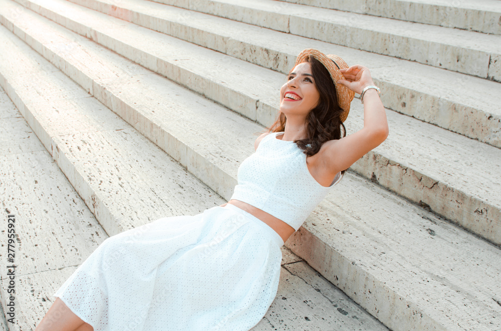 candid-woman-in-white-dress-sitting-street-style-stock-photo-adobe-stock