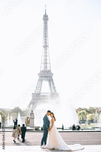 Happy romantic married couple hugging near the Eiffel tower in Paris © jul14ka
