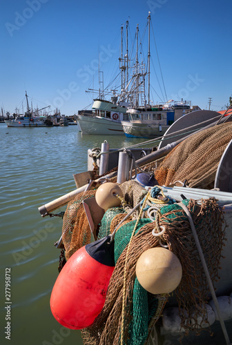 Steveston Fishboats Dockside. Commercial fishboats in the harbor of Steveston, British Columbia, Canada near Vancouver. Steveston is a small fishing village on the banks of the Fraser River. photo