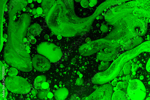 Green liquid bubbles abstract background. Macro photography