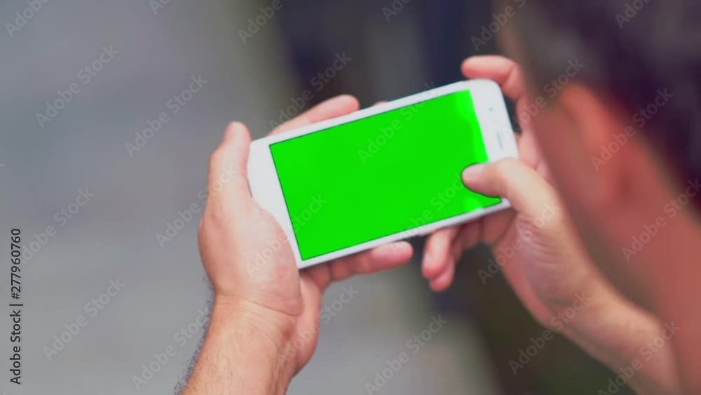 Man scrolling through information on a mobile