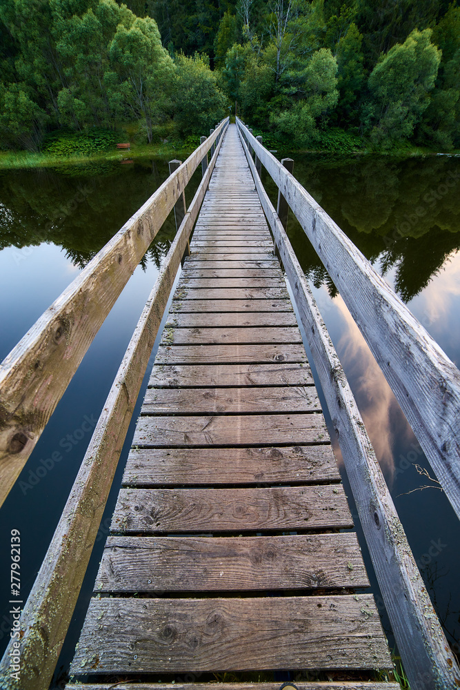 wooden bridge over the lake, river