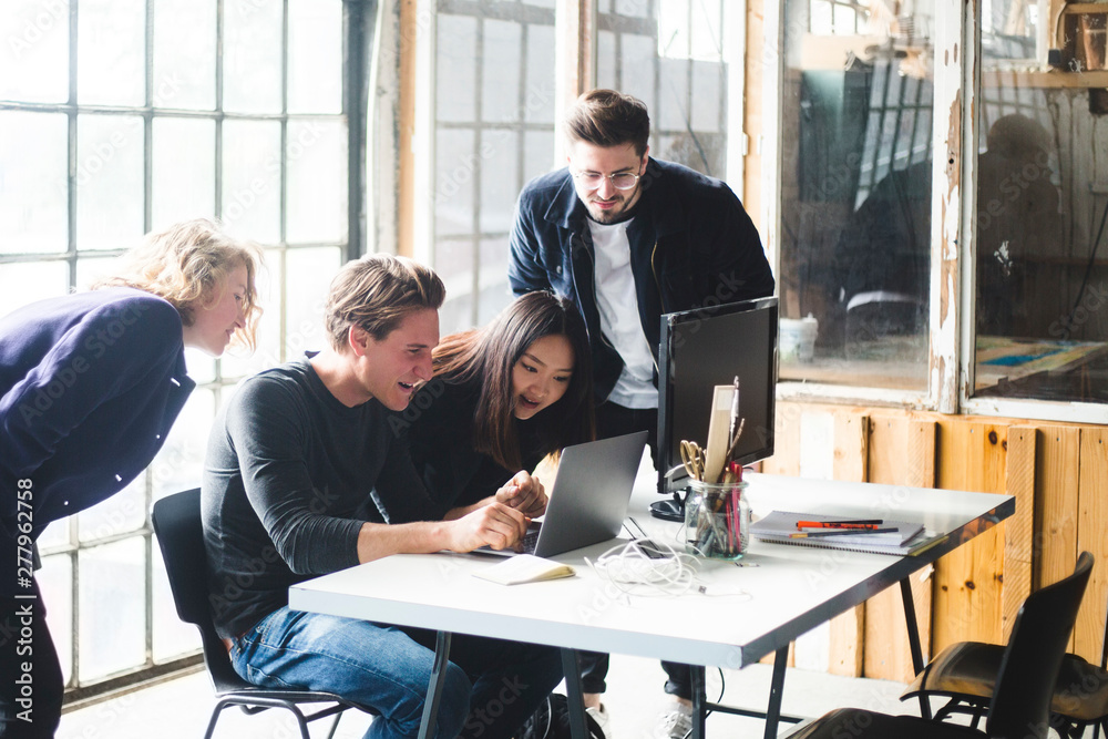 © Maskot - Business people working in office