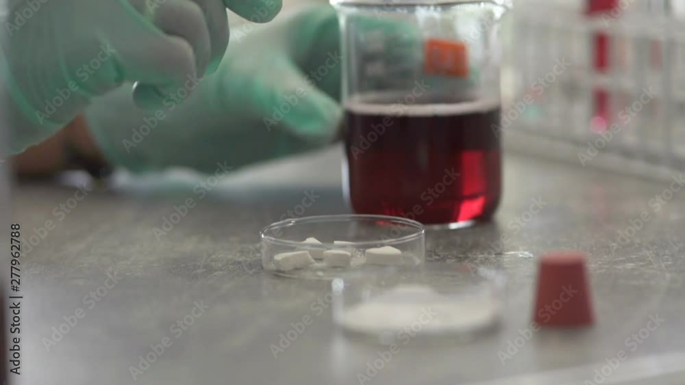 Woman scientist doing lab test with chemicals, slow motion Woman scientist doing lab test with chemicals, slow motion