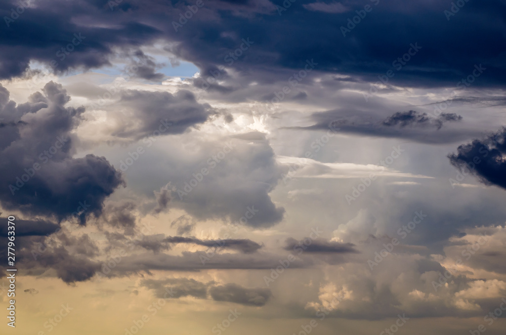 Beautiful stormy cumulus clouds in the sky, background. Beautiful stormy cumulus clouds in the sky, background.