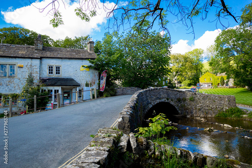 Packhorse bridge over the Malham Beck, Malham, Yorkshire Dales, North Yorkshire, England, UK, Western Europe. photo