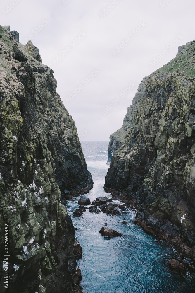 Cliffs in the ocean Faroe Islandds