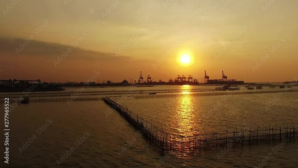 aerial view sunset Tanjung Emas Harbour , Tambak Lorok Vilages Semarang Central Java Indonesia aerial view sunset Tanjung Emas Harbour , Tambak Lorok Vilages Semarang Central Java Indonesia