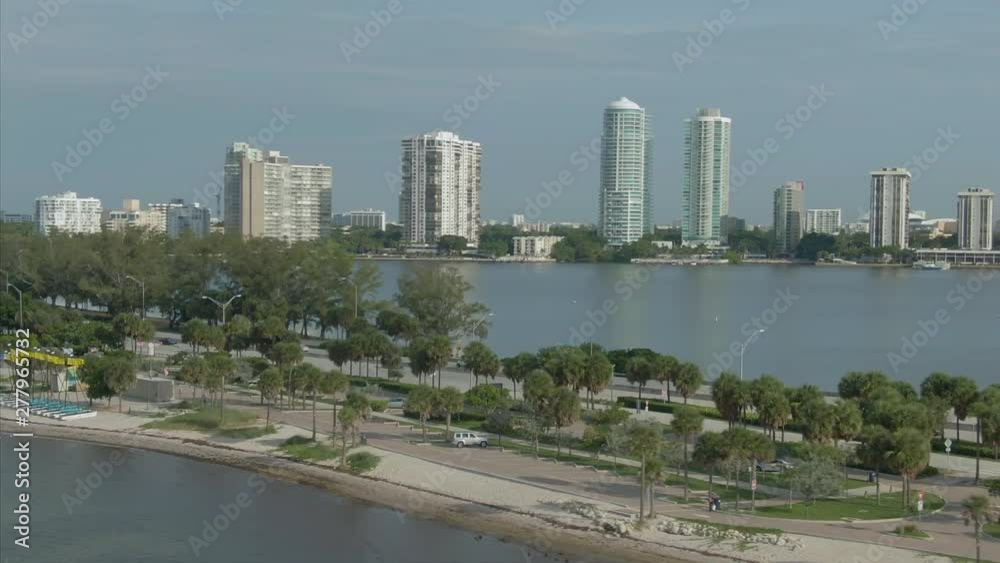 Aerial out to Downtown Miami and traffic on Rickenbacker Causeway in the Biscayne Bay. Miami. Florida Aerial out to Downtown Miami and traffic on Rickenbacker Causeway in the Biscayne Bay. Miami. Florida
