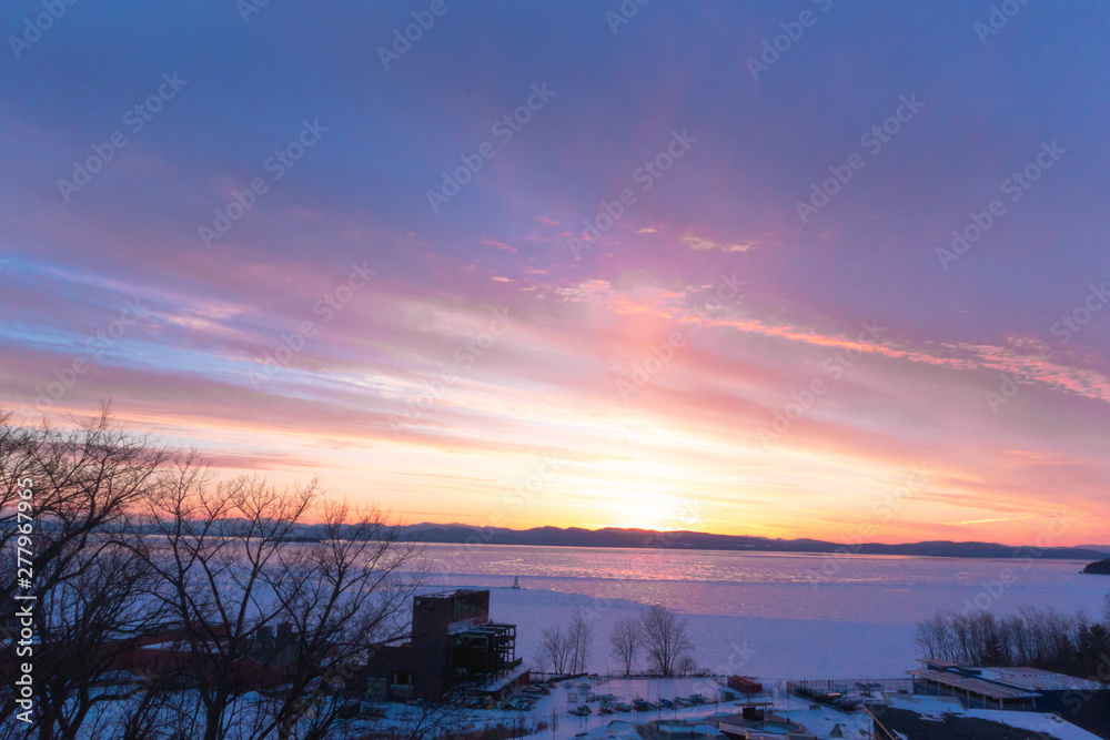 Fototapeta premium sunset over frozen lake