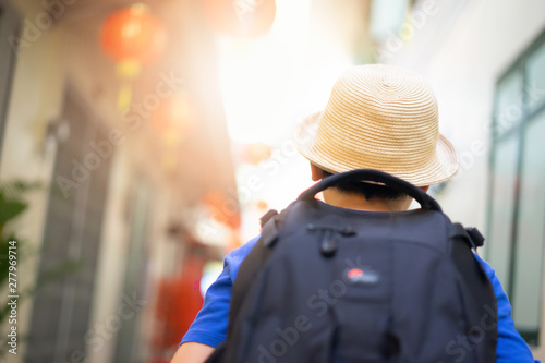 Little boy and backpacks are traveling by train.