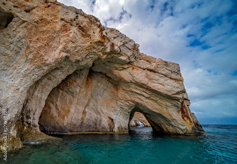 Fototapeta premium Stone arch entrance to one of Blue Caves
