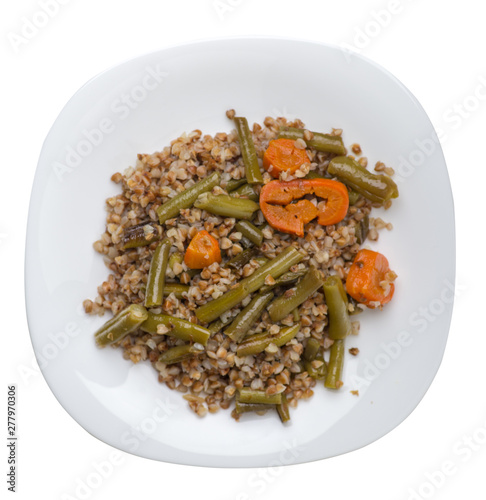 buckwheat with green beans with garlicand carrots isolated on white background. Diet breakfast on a plate.  food vegetarian top view photo