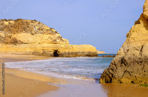 View on the beach Careanosy in Portimao with beautiful cliffs. Vacation in Portugal. photo