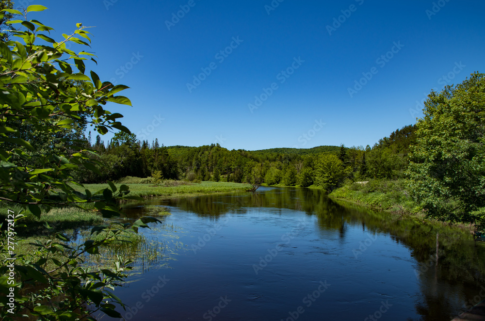 Moose pond in Saranac Lake NY and the Adirondack mountains Moose pond in Saranac Lake NY and the Adirondack mountains
