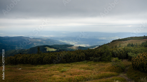A view from Mt Pilsko towards north west (facing the town of Zywiec) with a clouded sky and few light rays in the background, Zywiec Beskids, Poland