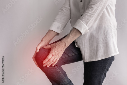 elderly woman having knee pain.