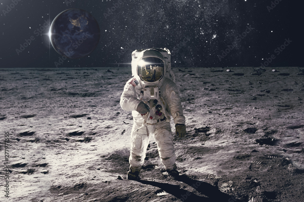 Wunschmotiv: Astronaut on rock surface with space background. Elements of this image furnished by NA