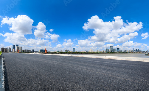 Empty asphalt road and modern city skyline in Shanghai