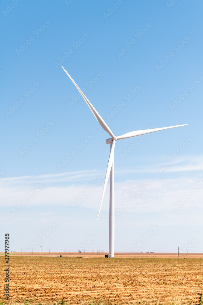 Wind turbine closeup with farm rual field near Snyder Texas in USA isolated and sky Wind turbine closeup with farm rual field near Snyder Texas in USA isolated and sky