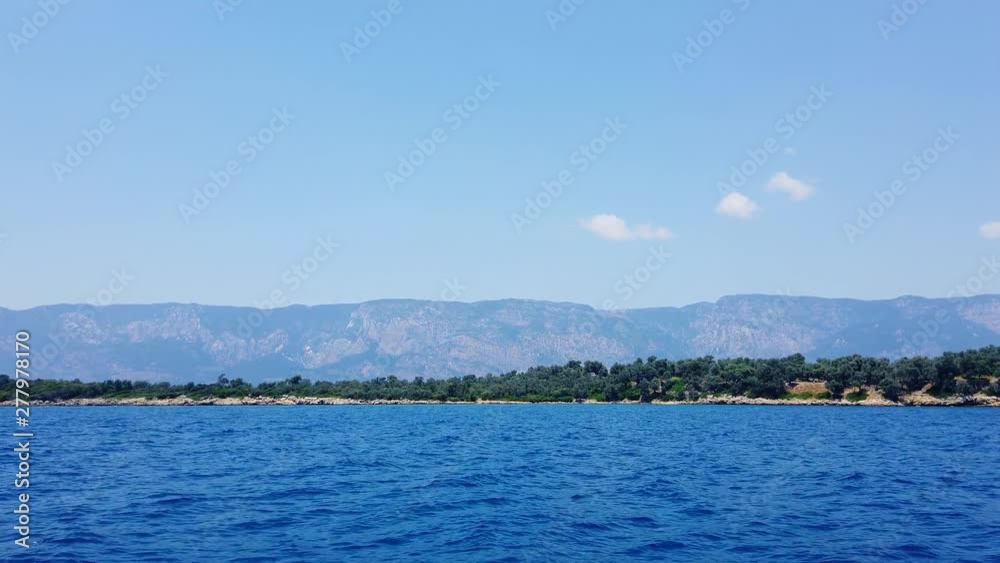 A tracking shot of idyllic Aegean islands in the summer, from Gulf of Gokova. Shot and presented at 60 fps. A tracking shot of idyllic Aegean islands in the summer, from Gulf of Gokova. Shot and presented at 60 fps.