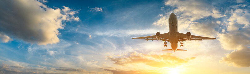 Airplane in the sky at sunrise