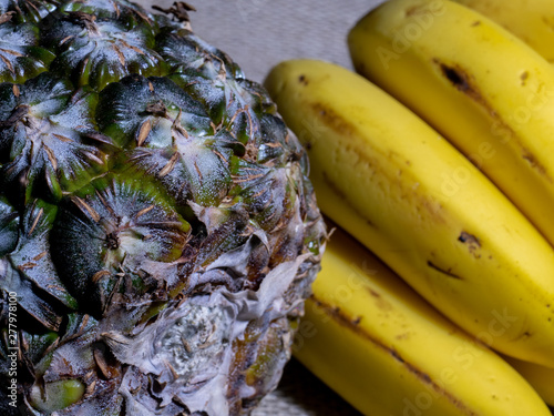 Pineapple and Banana closeup with jute background