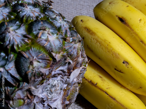 Pineapple and Banana closeup with jute background