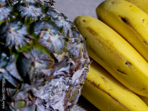 Pineapple and Banana closeup with jute background