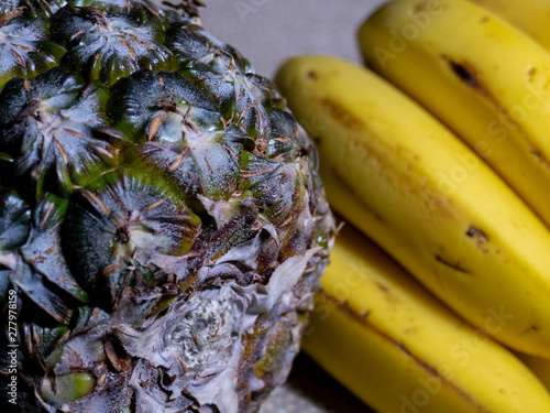Pineapple and Banana closeup with jute background