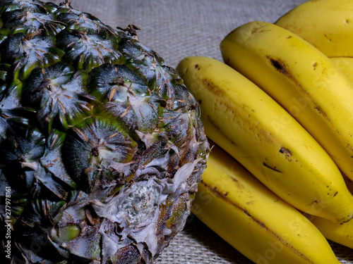 Pineapple and Banana closeup with jute background