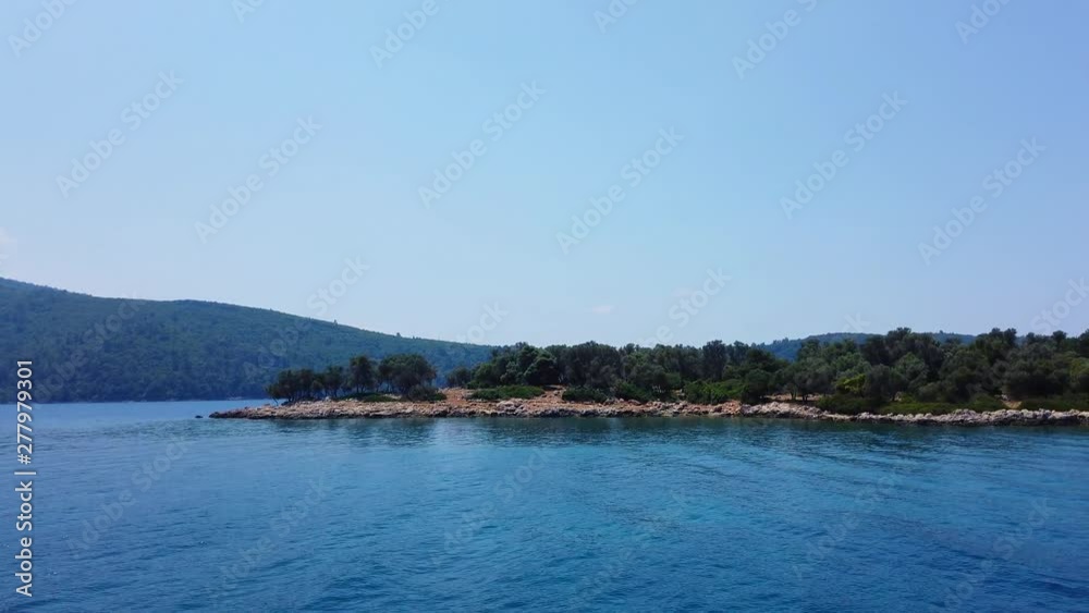 A tracking shot of idyllic Aegean islands in the summer, from Gulf of Gokova. Shot and presented at 60 fps. A tracking shot of idyllic Aegean islands in the summer, from Gulf of Gokova. Shot and presented at 60 fps.