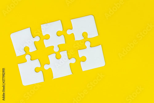 6 jigsaw puzzle on solid yellow background using as six important thing, solutions combine or working together to success or solve problem