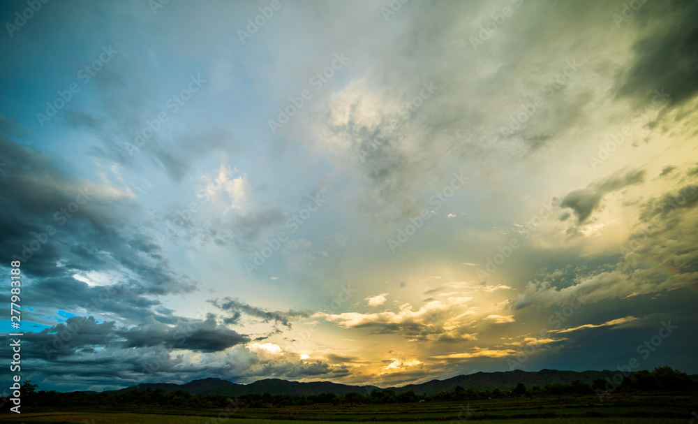 colorful dramatic sky with cloud at sunset.