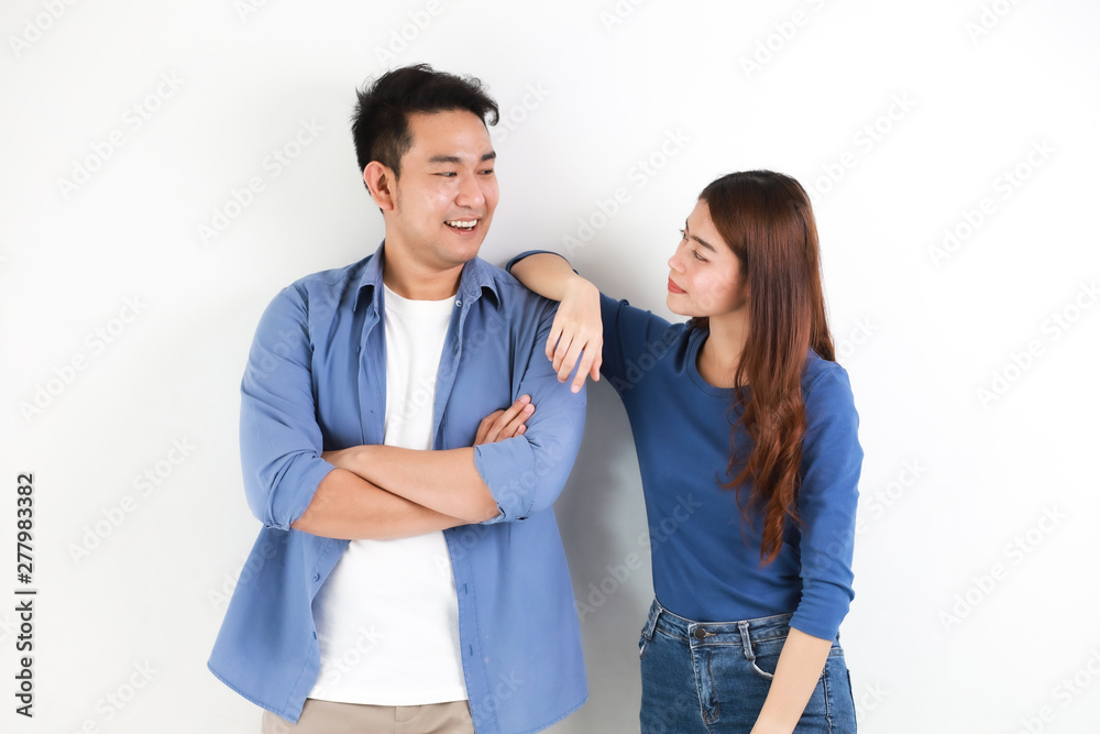 Asian couple in blue shirt on white background happy and smile mood Asian couple in blue shirt on white background happy and smile mood