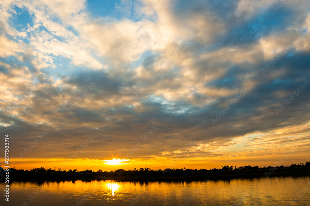 colorful dramatic sky with cloud at sunset.