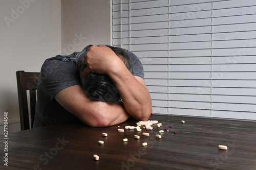 Εκτύπωση καμβά Distressed Man With Pills on Table