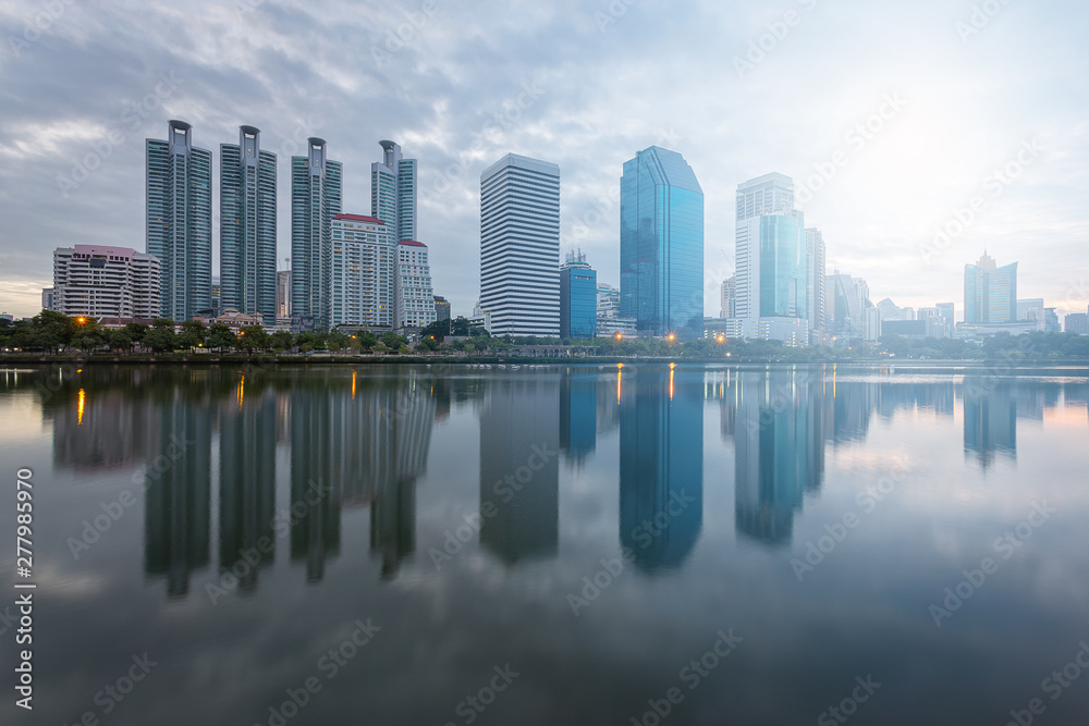 Fototapeta premium City building with water reflection before sunset