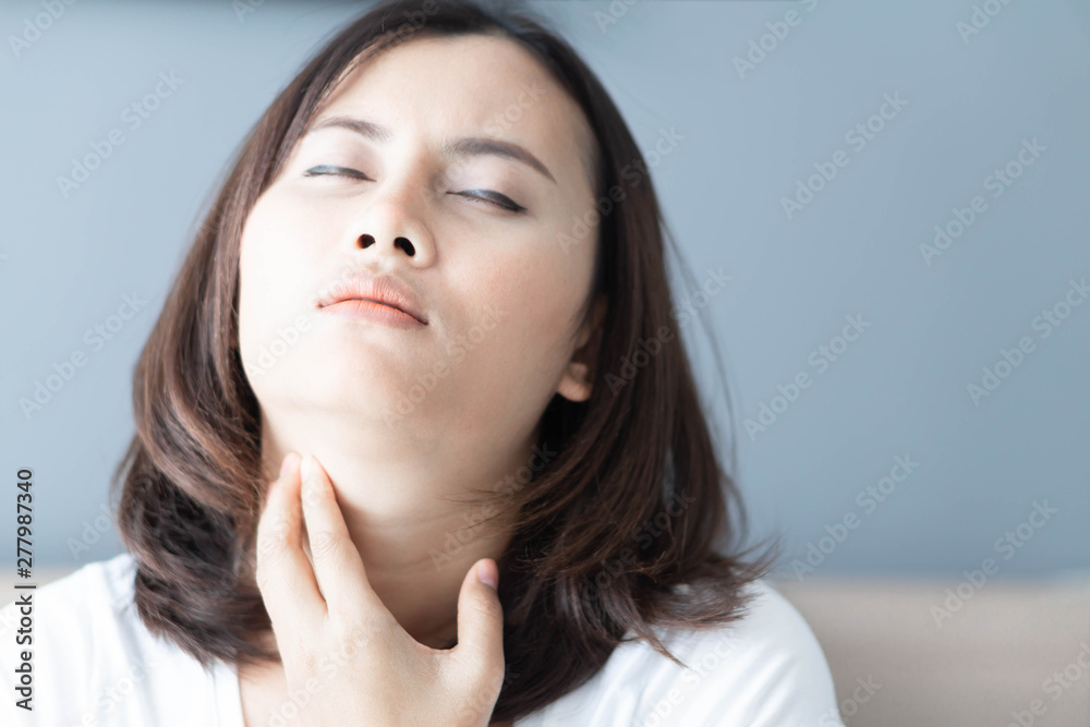 Woman sick with throat sore, health care and medical concept Woman sick with throat sore, health care and medical concept