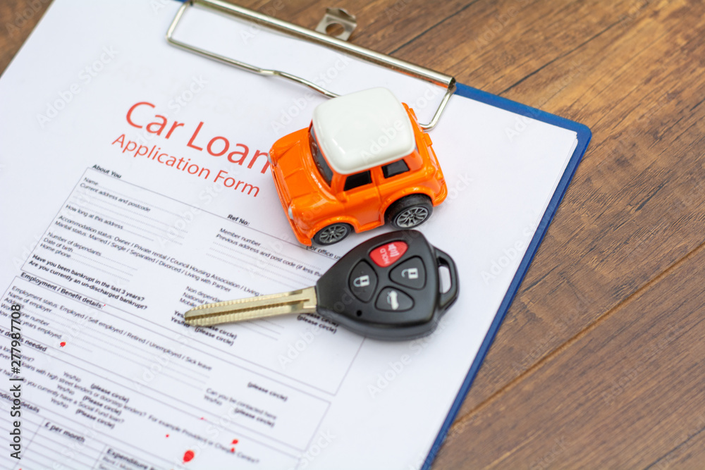 Car keys , car model on the signed agreement document Car keys , car model on the signed agreement document