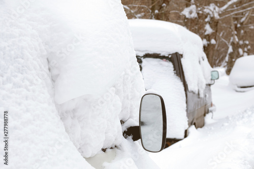 a number of cars covered with snow on the roof © metelevan