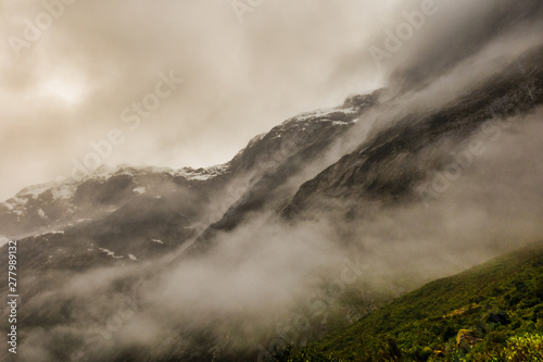 moody misty bad weather near Milford Sound in New Zealand