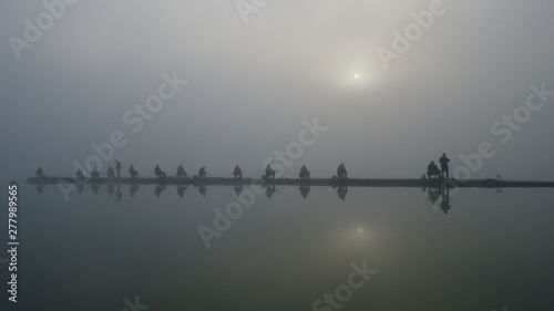 silhouette of people on bridge © aleksey24