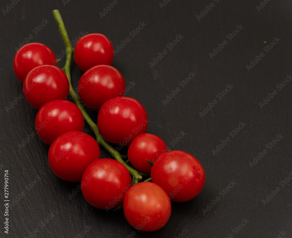 tomatoes on a black background