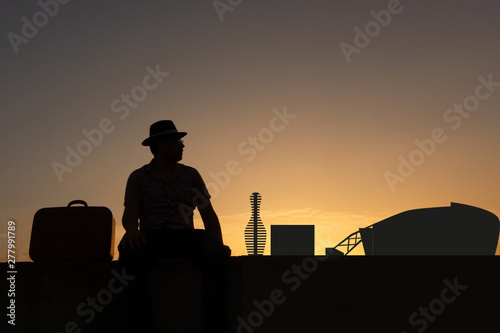 Traveler with suitcase and hat in front of city skyline of arlintong in united states