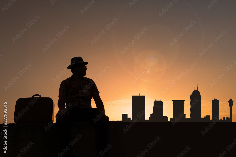 Traveler in front of Indianapolis city skyline