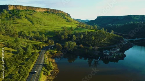 Mountains and Lakes day time Sun Set  Country side Green Grass Live stock Mountains and Lakes