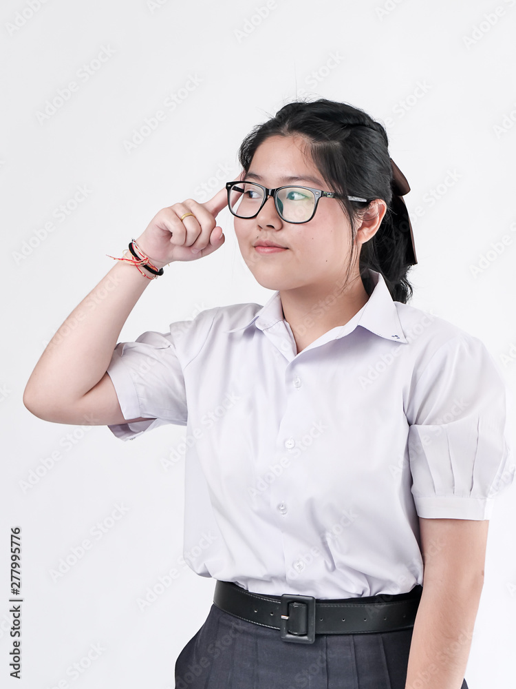 Happy Asian student in uniform on white background. Happy Asian student in uniform on white background.